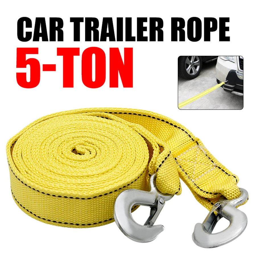 Yellow car trailer rope rated for 5 tons with metal hooks rolled into a coil.