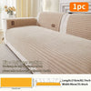 A beige non-slip minimalist sofa cushion cover shown on a light-colored sofa with matching striped pillow covers.