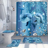 A blue dolphin shower curtain featuring sparkling blue and silver designs, with a matching bath mat on the floor.