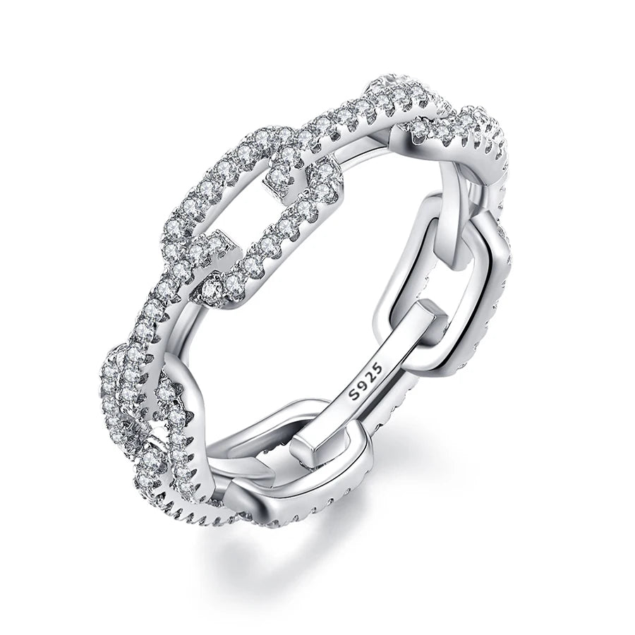 A close-up of a geometric sterling silver stackable ring with cubic zirconia stones.