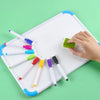 An assortment of eight fine tip whiteboard markers in various colors are displayed on a white board.