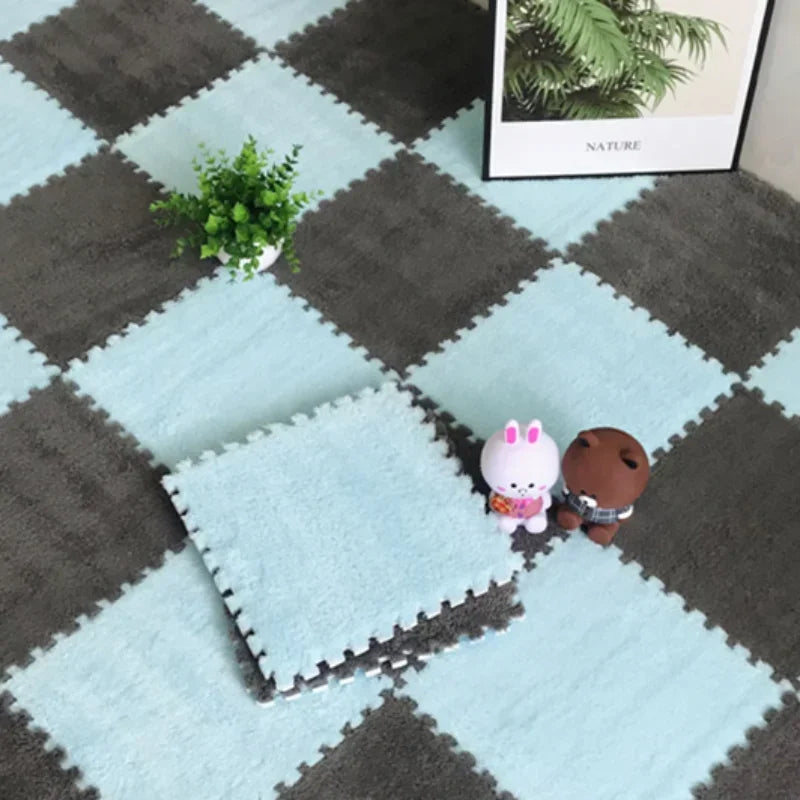 Soft plush interlocking floor tiles featuring cute pink and brown animal figures on a gray and light blue checkered mat.
