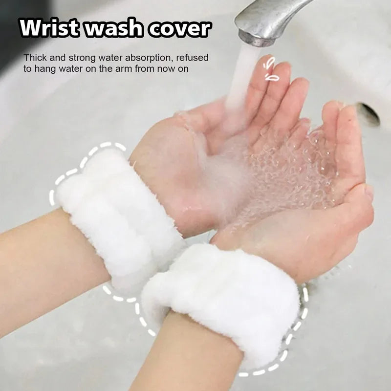 A hand is holding a white wrist wash cover, with water flowing onto the skin.