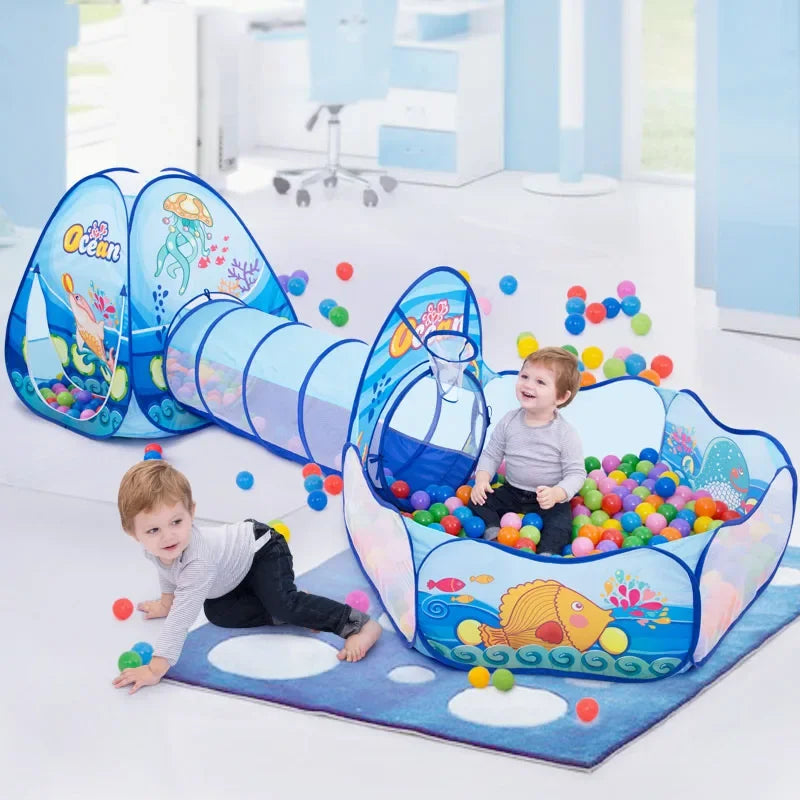 A colorful 3-in-1 kids ball pit play tent with a crawl tunnel is set up on a white floor for children's play.