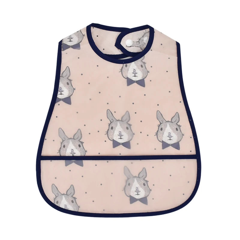 A light pink baby feeding bib featuring a repeating pattern of gray rabbits and a black trim.