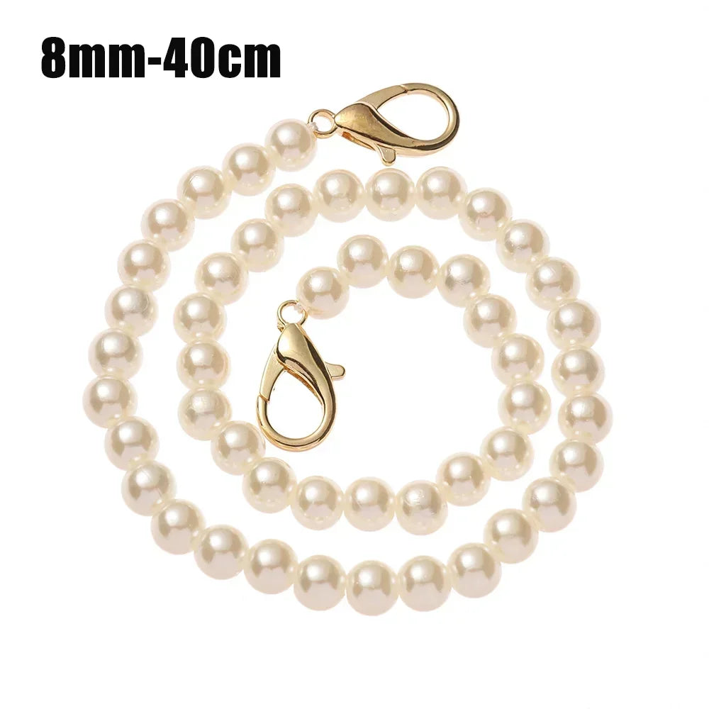 A delicate gold-toned pearl chain strap measuring 8mm to 40cm.