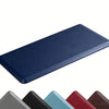 A dark blue anti-fatigue standing mat with a textured, non-slip surface shown from above.