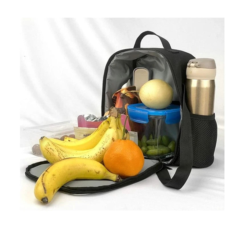 A black backpack set containing a lunch bag and pencil case, with bananas and an orange visible.