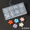 A silicone nail art mold featuring various floral shapes in translucent and opaque colors, including pink, orange, blue, and 