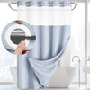A light blue dotted waffle weave shower curtain hanging on a rod with a snap-in liner visible.