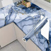 Marble pattern peel and stick self-adhesive wallpaper featuring blue and white marble with gold veining