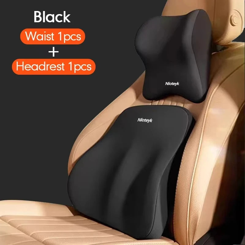 Black memory foam car headrest and lumbar support cushion placed on a beige car seat.