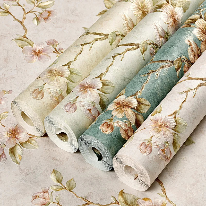 Rolls of 3D embossed floral self-adhesive wallpaper in soft green and beige tones.