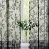 Vintage floral lace curtain panel with light filtering featuring a delicate pattern and vertical stripes.