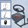 A black foldable overhead tripod with a ring light and a wireless shutter remote for phone photography.