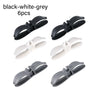 Six black and white-grey cord organizers or wire winders for tidy cable management.