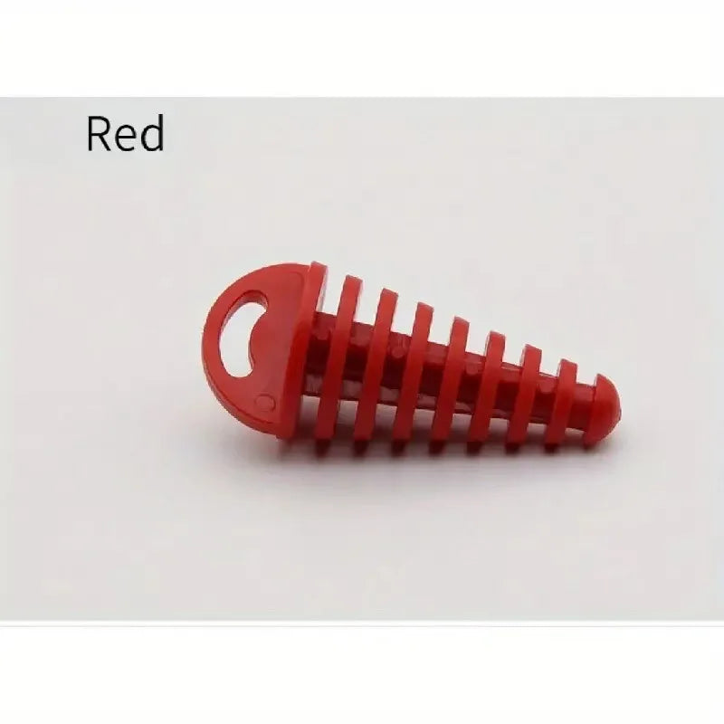 A red rubber exhaust wash plug with a keychain tag for motorcycles and dirt bikes.