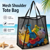 Black mesh shoulder tote bag filled with colorful toys on a wooden surface near the ocean