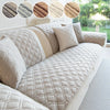 Light beige anti-slip sofa cover featuring a quilted geometric pattern with brown accents.