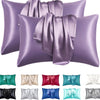 A collection of silky smooth satin pillowcases in various shades including purple, green, pink, and gray.