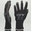 A pair of black breathable PU-coated work gloves with reinforced grip and CE certification logos.