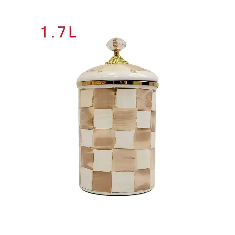 A square porcelain storage jar with a gold lid featuring a beige and white checkerboard pattern.