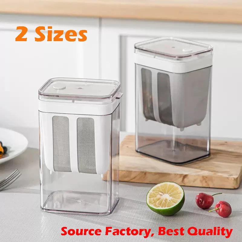 Clear glass yogurt strainer with a fine mesh filter and a stainless steel base shown on a wooden cutting board.