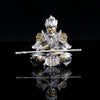 Silver hand-painted figurine of the Monkey King with staff, displayed against a black background.
