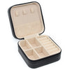 A black PU leather jewelry storage box with a hinged lid and divided compartments for travel and home use.