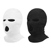 A pair of black and white ski mask car headrest covers shown side by side.