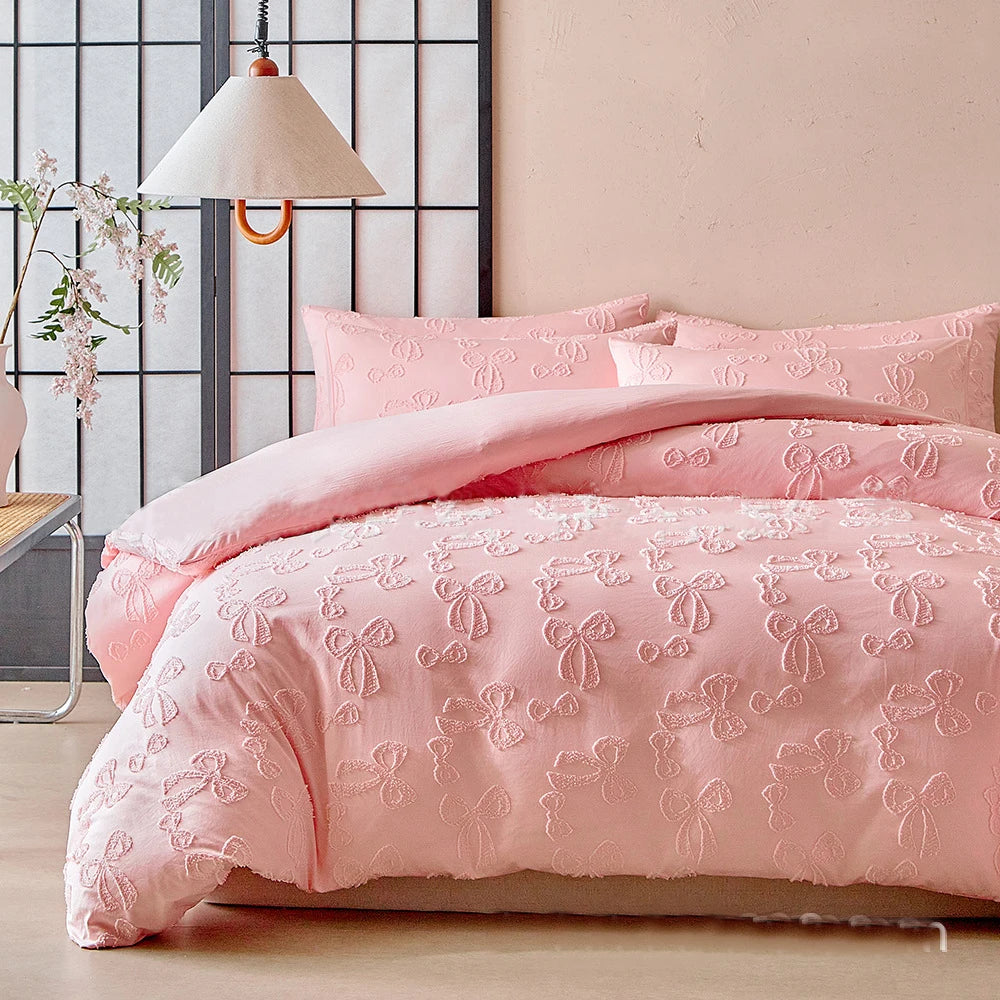 Pink duvet cover set with a Nordic leaf print pattern displayed on a bed.