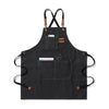 A black canvas apron with long straps and large front pockets for oil-proof use.