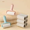 A pink mini portable lint roller is shown next to a stack of beige towels.