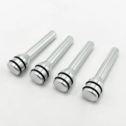 A set of silver aluminum alloy car door lock pins with decorative heads.