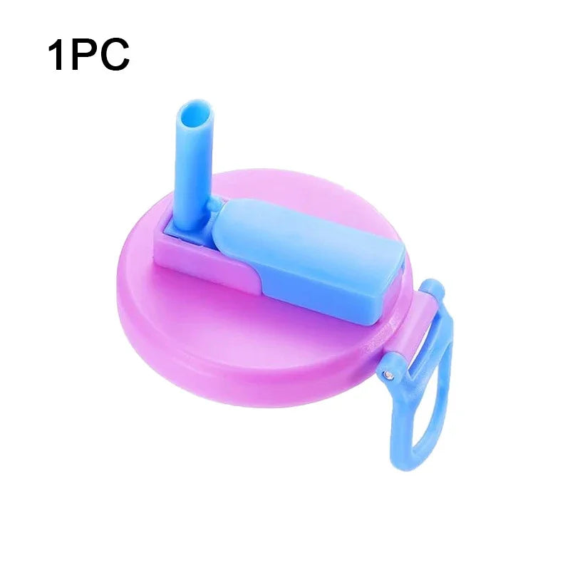 A pink silicone can lid with a blue straw is shown, designed for reusable use.