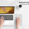 A person is using a laptop and a white mouse pad, demonstrating the innovative design of the product.