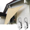 Stainless steel swivel pulley with hook used to suspend a beige fabric banner from a building facade.