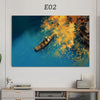 An abstract painting featuring a yellow boat on blue water with vibrant autumn foliage.