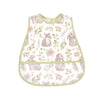 A light green baby feeding bib featuring a watercolor pattern of gray rabbits and green foliage.