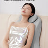 A woman is lying down comfortably on a light gray sofa, resting her head on an ergonomic memory foam wedge pillow.