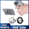 A hand holds a silver magnetic phone holder ring stand designed for MagSafe compatibility.