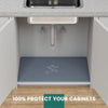 A flexible silicone sink protector mat installed in a cabinet, designed to prevent damage.