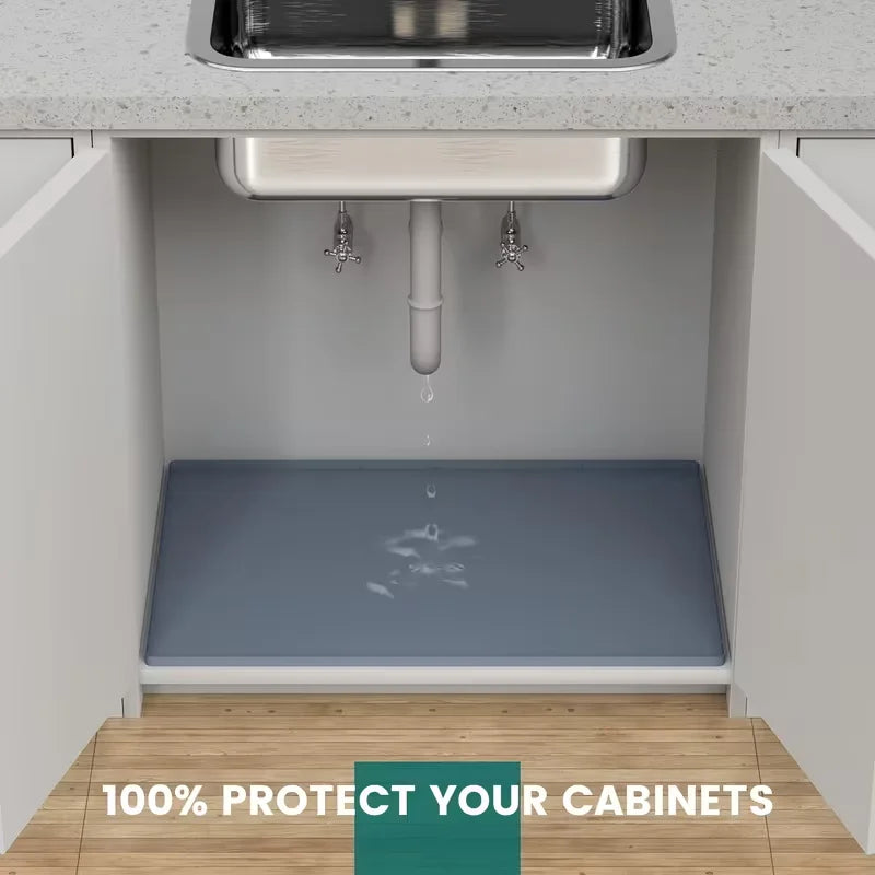 A flexible silicone sink protector mat installed in a cabinet, designed to prevent damage.