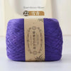 Purple bamboo fiber yarn skein labeled as 22 count for knitting and crochet