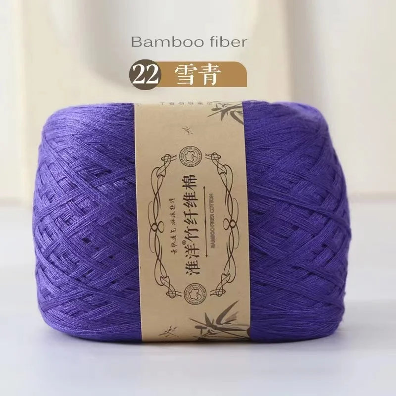 Purple bamboo fiber yarn skein labeled as 22 count for knitting and crochet