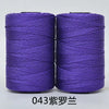 Two spools of purple 3-ply polyester knitting yarn for crochet and hand crafts