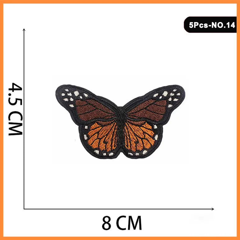 Five embroidered butterfly iron-on patches with orange and black detailing.