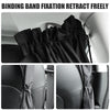 Black binding band fixation retract freely on a car window privacy divider curtain.