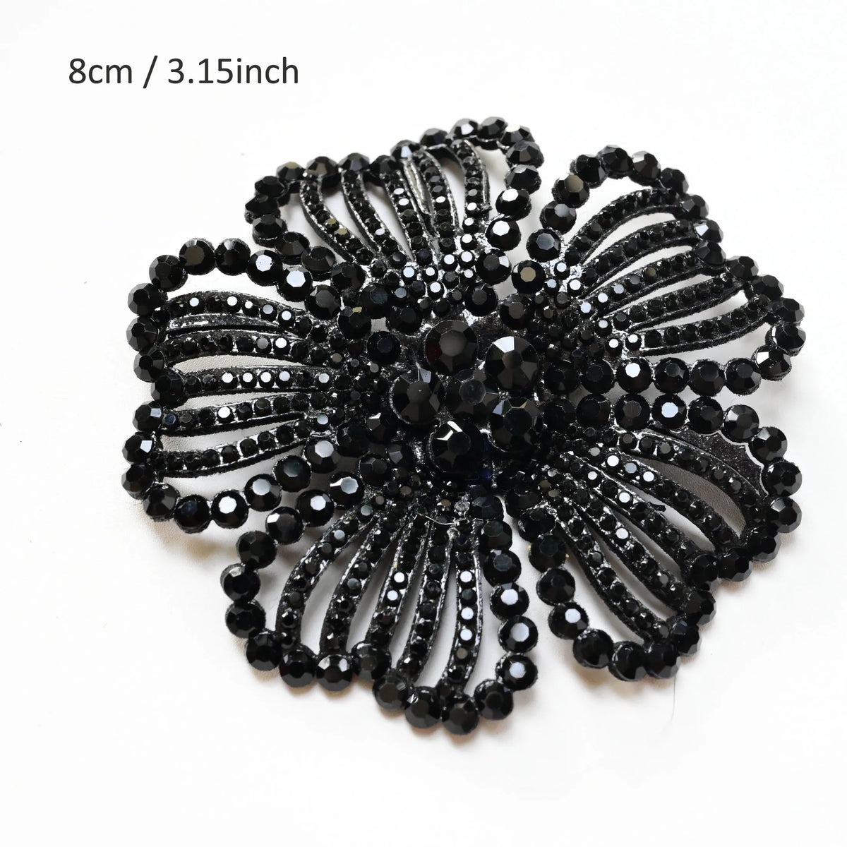 Black crystal rhinestone flower sew-on patch with a detailed, multi-layered design.