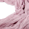 Soft dusty pink cotton gauze table runner draped in flowing folds